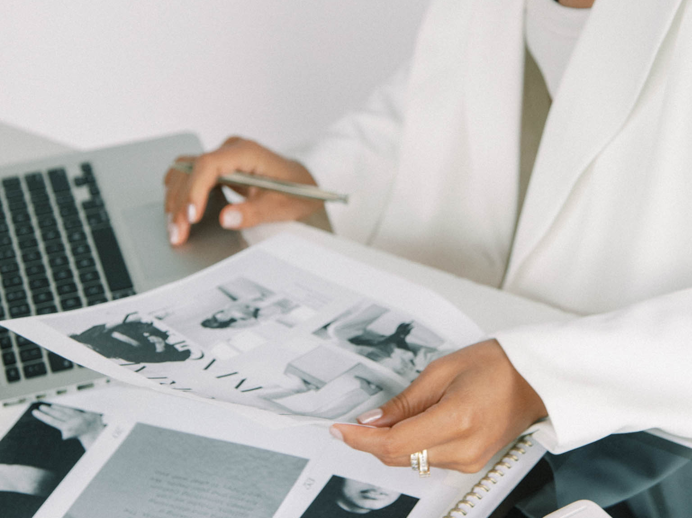 Focused businesswoman sitting at her desk, meticulously reviewing branding documents. Engaged in crafting a unique and impactful personal brand for her business.